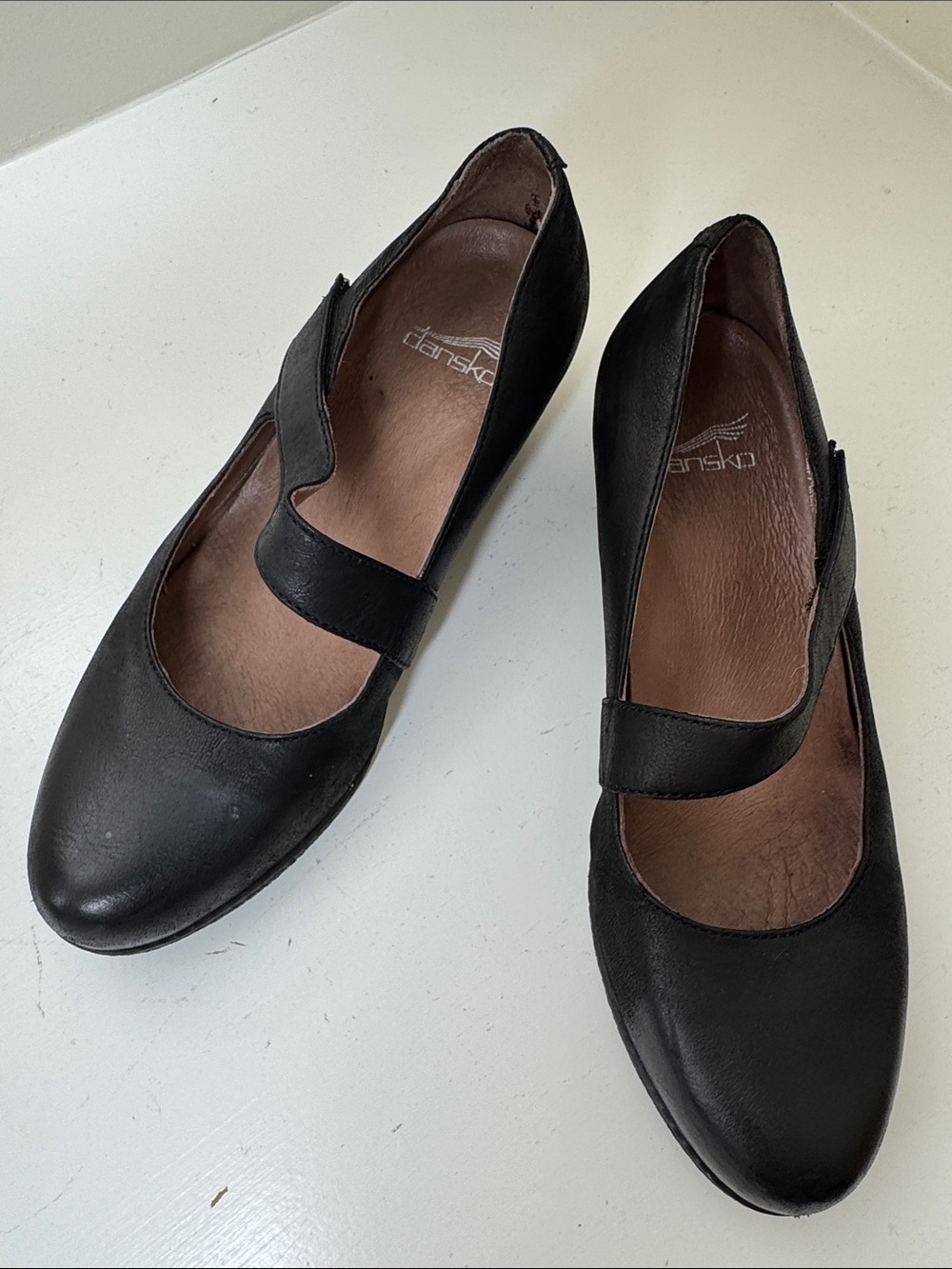 Dansko “Lanie” black leather Mary Janes with wedge heels. 39.